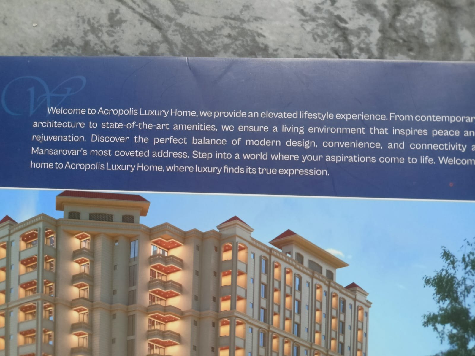 Acropolis reference brochure showing a residential building visualization